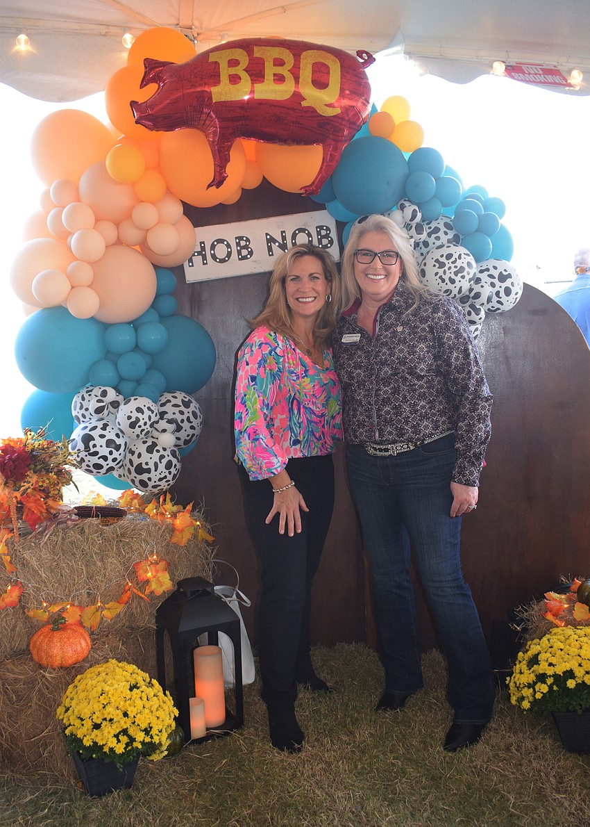 Heather Koester and Jacquie Johns with Invigorate Nexus connect with others in the business community at the Hob Nob.