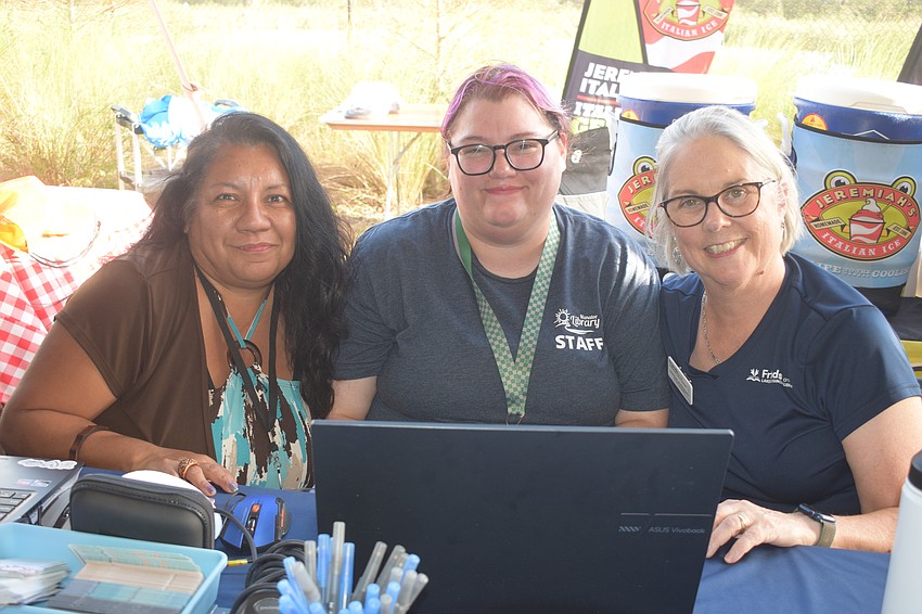 Fiorella Colacci and Hayley Rigatti, who are librarians at Lakewood Ranch Library, and Lindsay McSweeney with the Friends of the Lakewood Ranch Library share information about the new library with Hob Nob attendees.