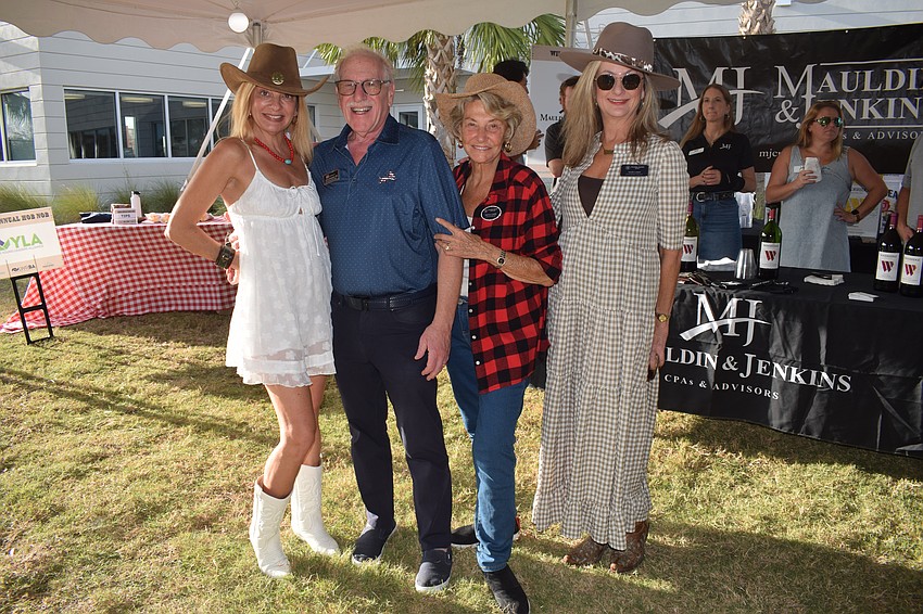 Lori Cashi with Coldwell Banker, Bruce Abramson with KW Commercial and Paula Cashi and Tami Cashi with Coldwell Banker make their rounds at the Hob Nob.