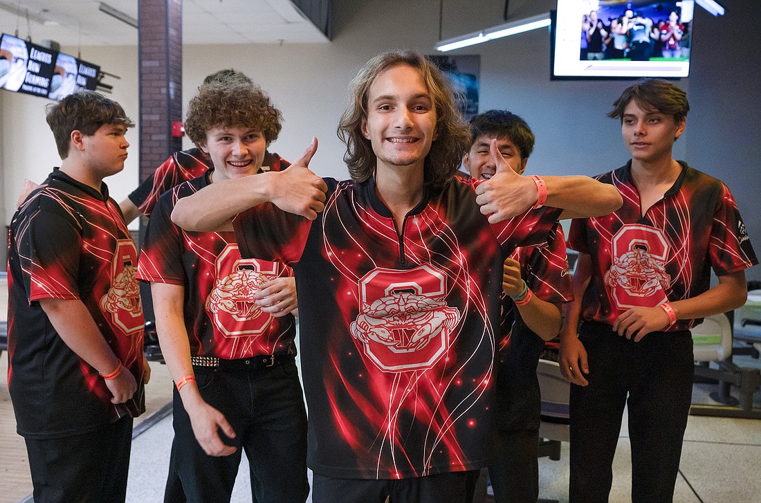 Dalton Boice (center) and the Seabreeze boys bowling team won the state championship on Oct. 31 at Boardwalk Bowl in Orlando. Photo by Michele Meyers