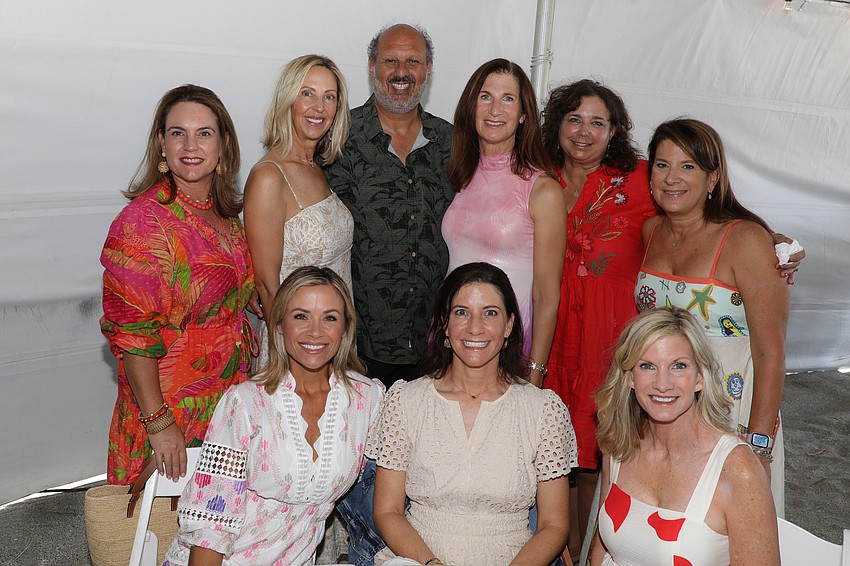 You can title this one 'Beauties and the Beast, said Children First CEO Philip Tavill as he jumped into this photo op with Haven Beach, Julie Sparma, Teri Sayre, Lesley France, Leslie Jones, (Tavill), Joyce Weiss, Susie Scarlett and Marsha Sutter