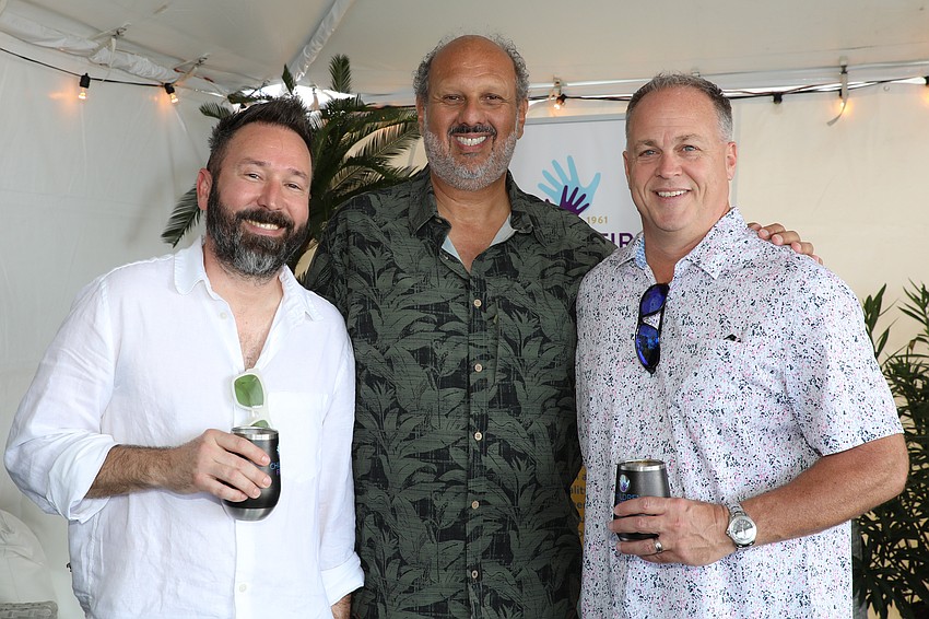 Quentin MacDonald, Children First CEO Philip Tavill and Robbie Hoskins