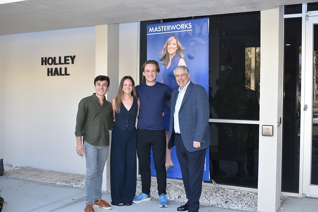 Sarasota Orchestra members Bobby Nunes, Stephanie Bloch and Hugo Bliss pose with Joseph McKenna, president and CEO of the orchestra.