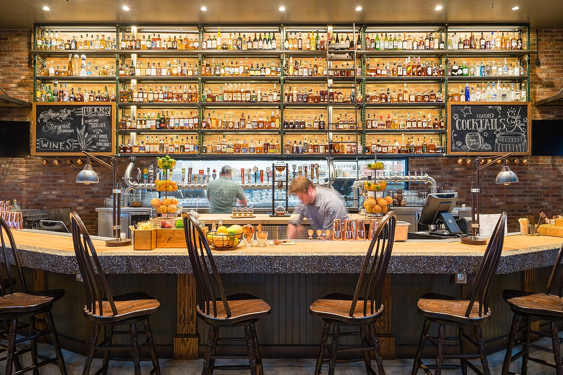 The Whiskey Wall at Whiskey Cake features 200 spirits. The restaurant in Town Center is at 10209 River Coast Drive in the former Ida Claire space.