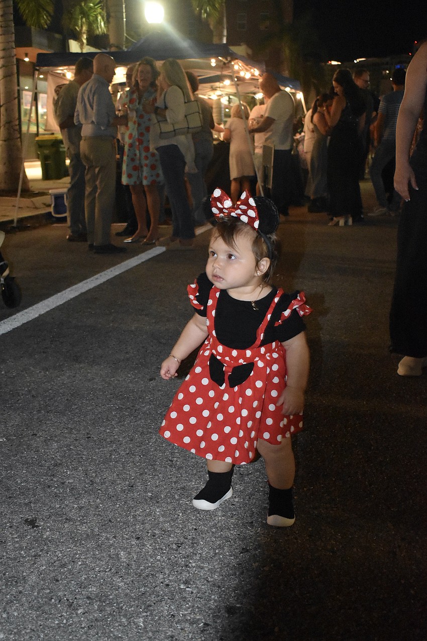 Sophia Aguila, 1, explores the event.