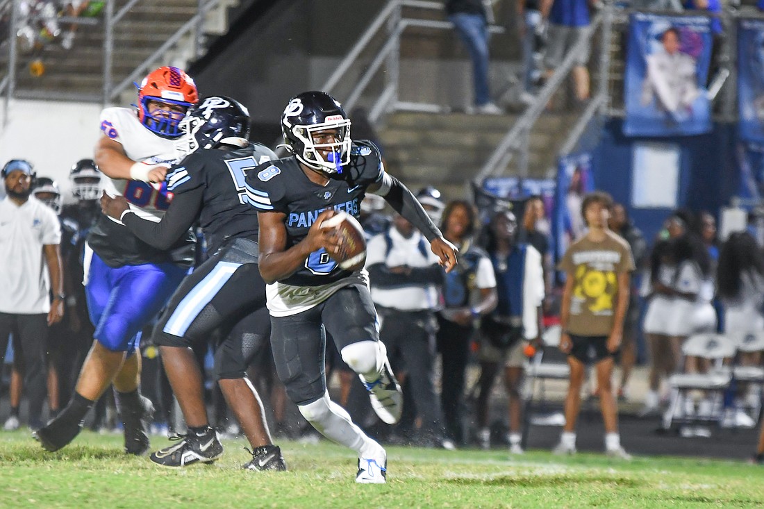 Dr. Phillips football quarterback Stanley Anderson-Lofton scrambled away from pressure in the Panthers' 33-11 win over West Orange.