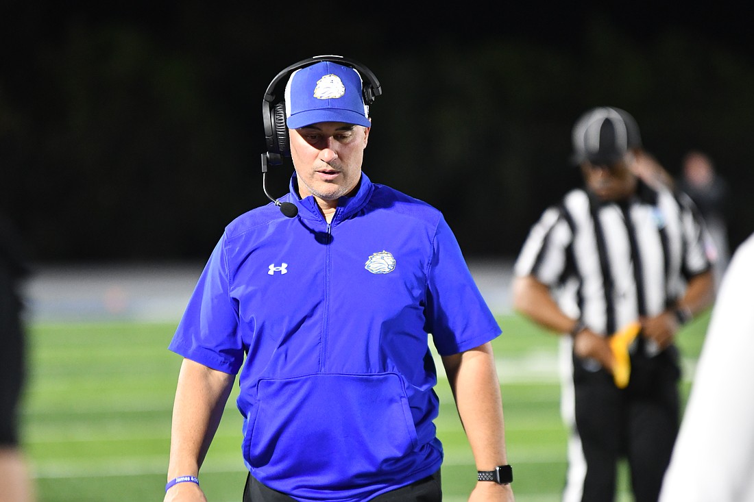 The First Academy football coach and athletics director Jeff Conaway roamed the sideline of Warren Stadium.