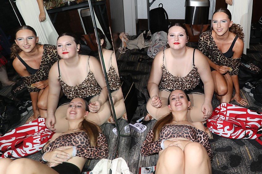Dancers and friends: Ava Ashley gets comfortable while Lilah Walsh and Vivian Elliot help with makeup.