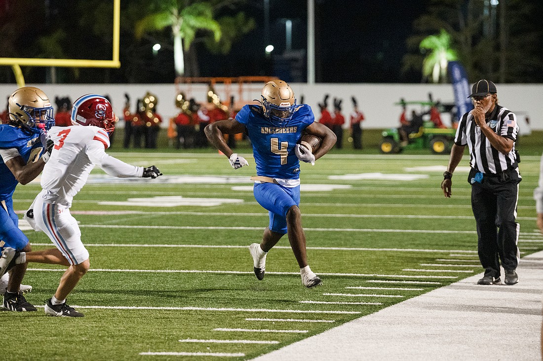 Mainland running back Edward Williams (4) runs out of bounds against Seabreeze on Nov. 1. File photo by Michele Meyers