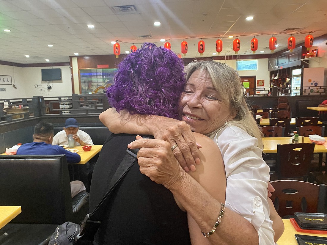 Aeryell Dunnuck, a volunteer, hugs Carol Felts to congratulate her on winning the Manatee County Commission District 1 race.