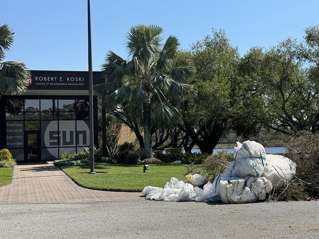 Hurricane debris was piled up outside the Sun Hydraulics plant on University Parkway on Oct. 15. The facility is still being repaired as of Nov. 6.