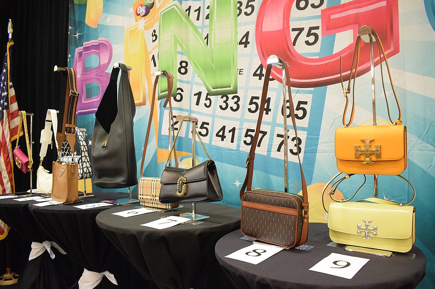 Nine designer bags are waiting to be won during a game of bingo.