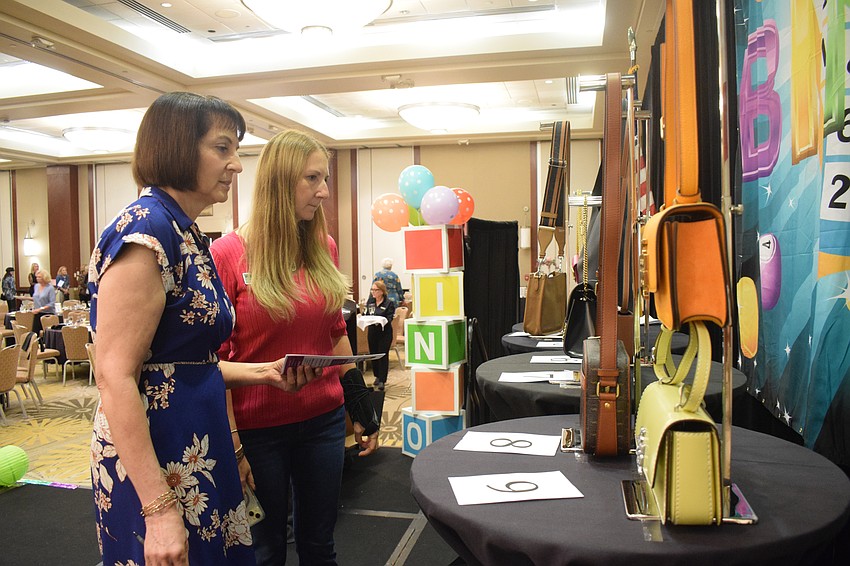 Sarasota's Aleene Crognale and Lakewood Ranch's Dianne Kopczynski take a closer look at the designer bags.
