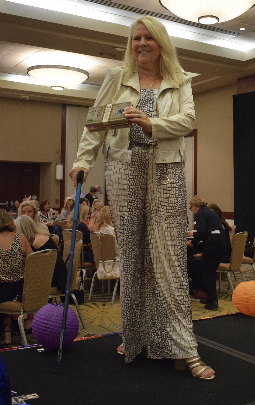 Becca Towery models an outfit from Darci's Boutique on the runway.