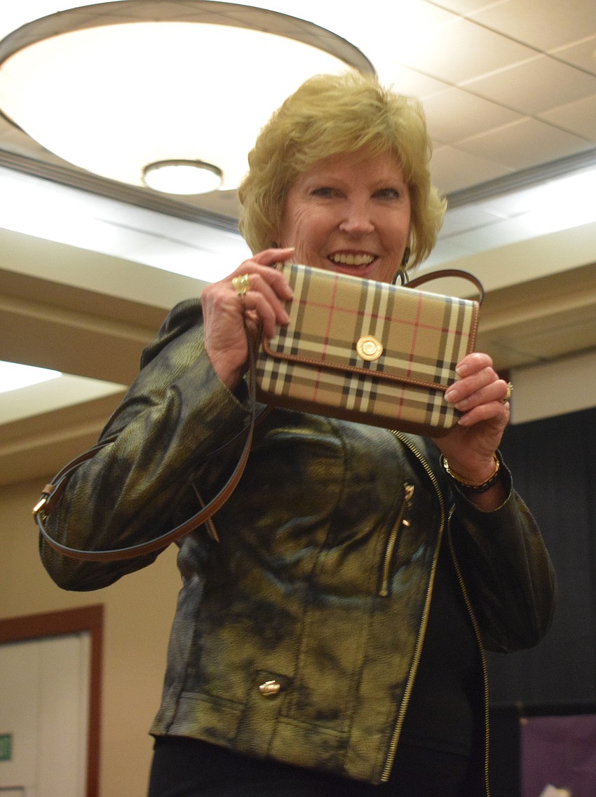 Kathy Collums gives women a closer look at one of the designer bags they could win.
