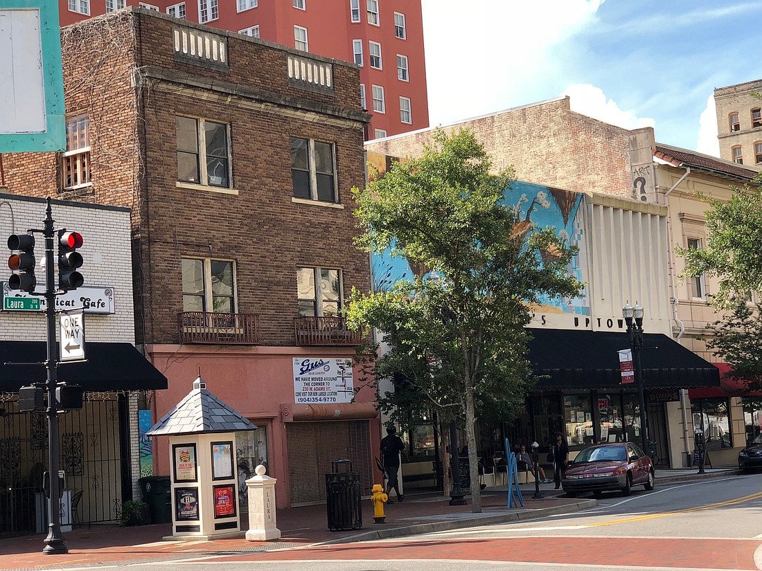 The three-story building at 225 N. Laura St. between Chamblin’s Uptown and the defunct Mag’s Cafe is planned for a ground-floor restaurant with apartments on the upper floors.