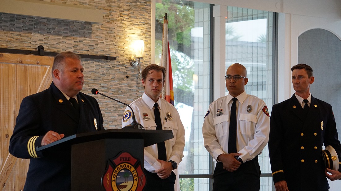 Asst. Chief Martin Szalbirak awarded Firefighter Paramedic David Oliger, Firefighter Paramedic Tirso Guerrero and Lt. Daniel Heath with a Phoenix Award.