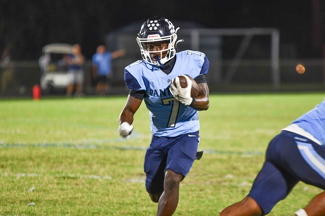 Panthers running back Kenorris White carried the football.