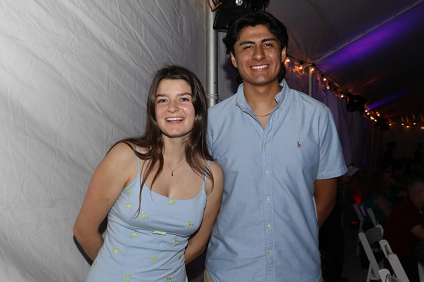 Barefoot friends Alexi Hornacek and Emilio Montiel enjoy a kick-back evening.