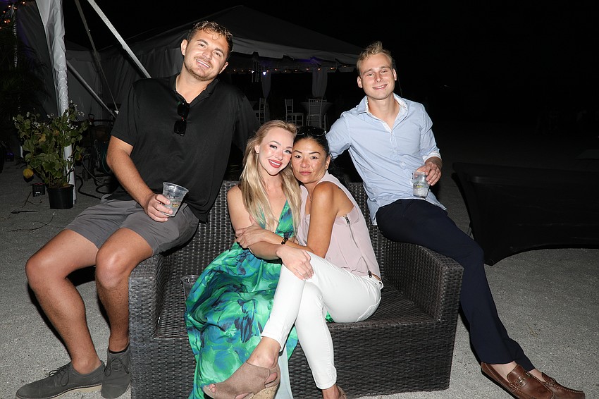 Sean Bruenner, Sam Schalk, Michelle Atkinson and Andrew Sweat enjoy a Gulf of Mexico sunset.