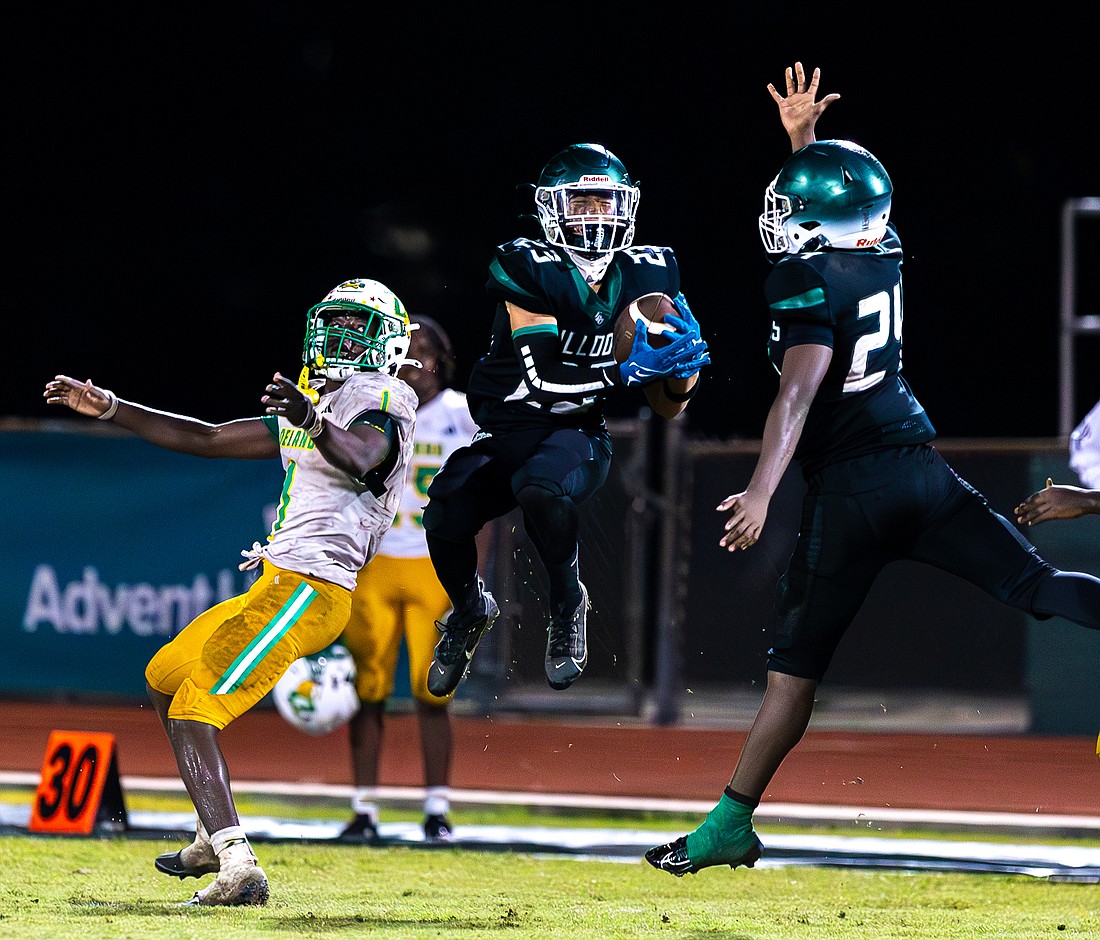 Lucas Siharaj intercepts a pass with 59 seconds left in the game to secure FPC's 62-57 victory over DeLand on Nov. 7. Photo by Keishia McLendon