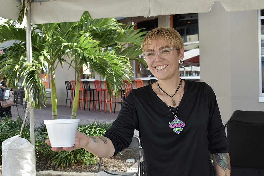 Nicky Danner serves hot chili for Gecko's Grill & Pub.