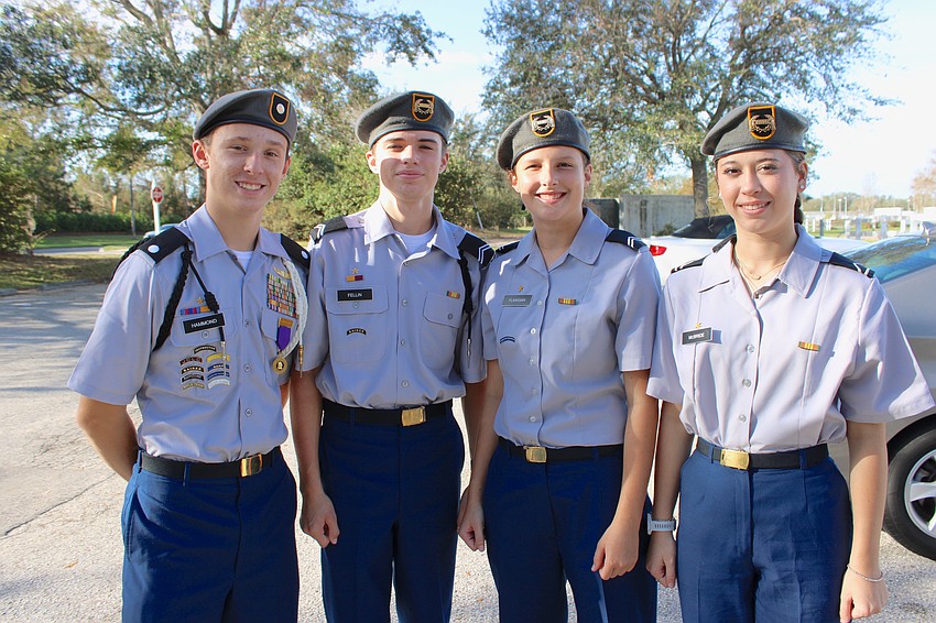 Lakewood Ranch High JROTC's Ben Hammond, Jake Fellin, Abigail Flanigan and Ashon McBride handled the color guard duties during McNeal's parade to honor veterans.