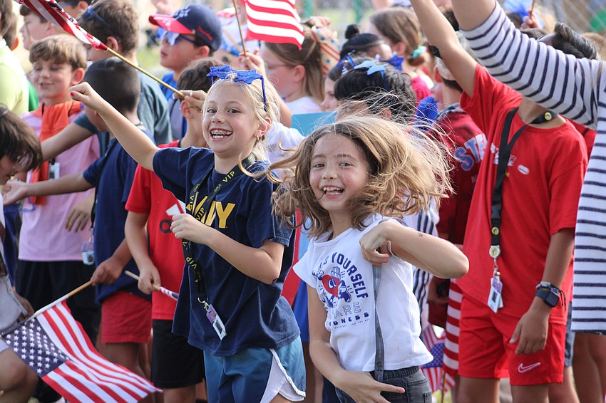 Gilbert McNeal fourth graders Morgan Drackett and Kaliah McManus show some dance moves during the Veterans Day celebration.