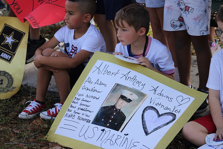 Gilbert McNeal first grader Alec Adams made a sign for the parade that was close to his heart.