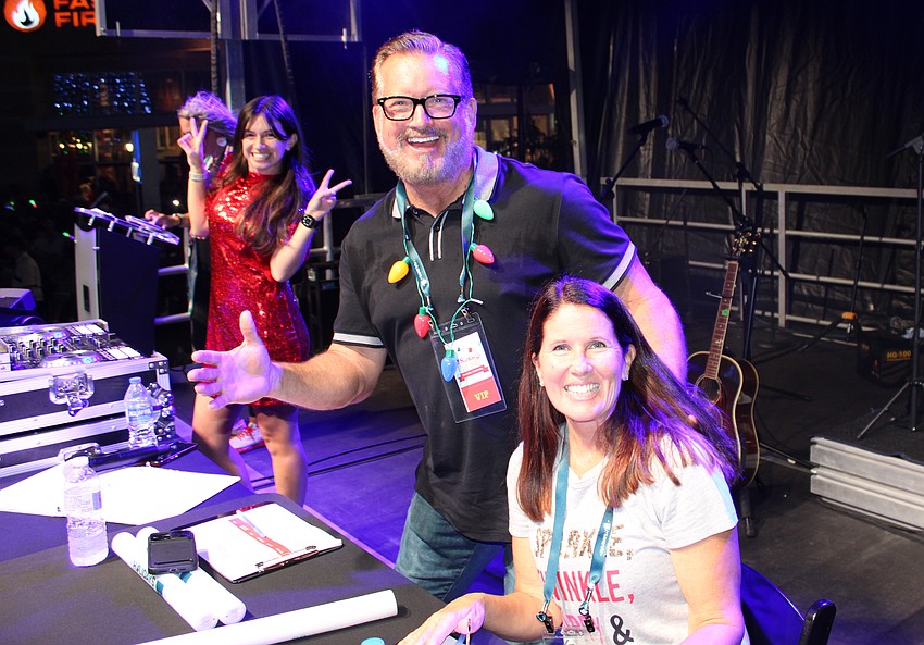 DJ Sarah Masters has some fun behind Manatee County Commissioner Mike Rahn and Sarasota County Commissioner Teresa Mast, who served as parade judges.