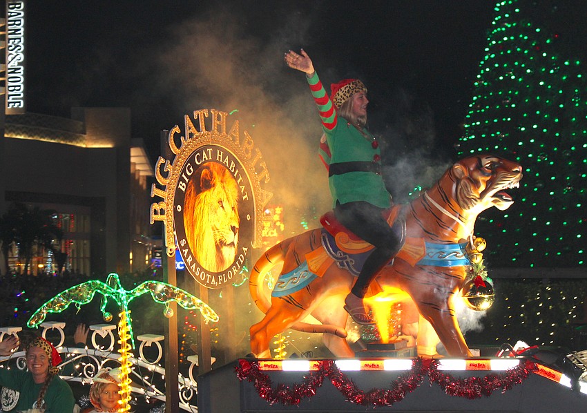 If you are the Big Cat Habitat, you've got to pick someone to ride a tiger on your float.