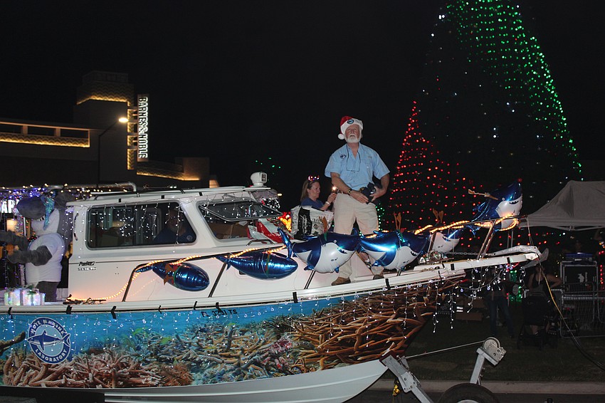 Mote CEO Michael Crosby floated into the Santa's Grand Arrival Parade.