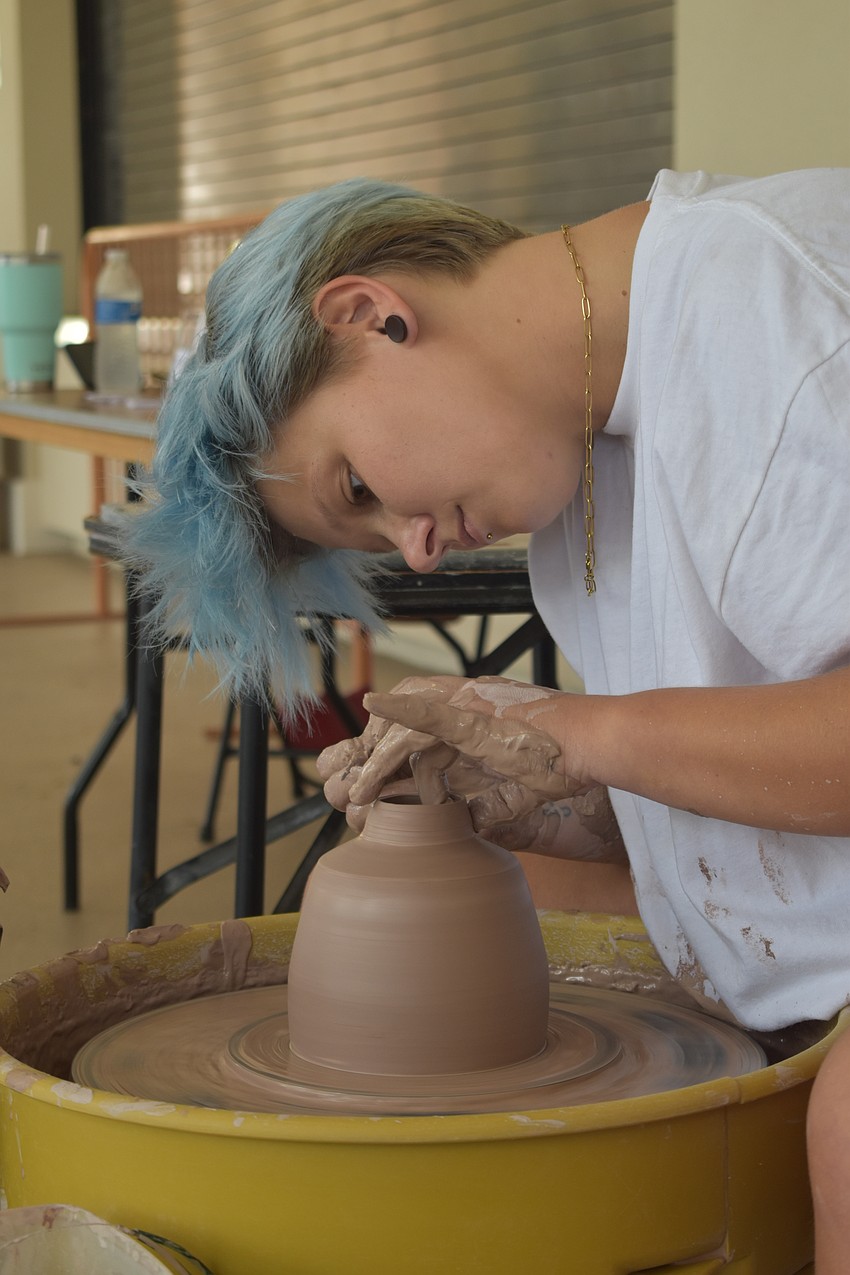 Kristen Berry of Sarasota Clay Company makes a bowl.