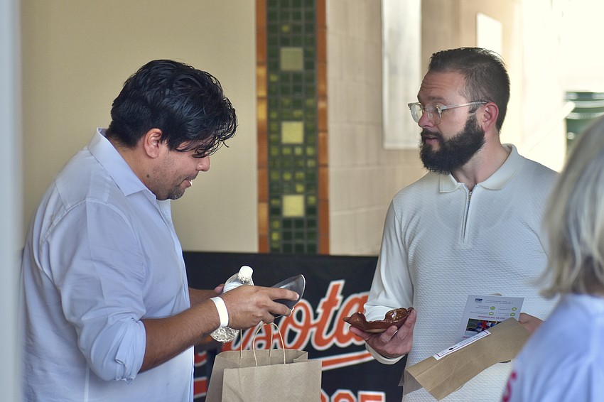 Adrian Ruiz and Tyler Murner browse the bowls.