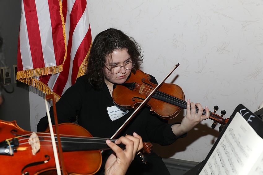 Music major Rachel Demoranville perfoms during the luncheon.