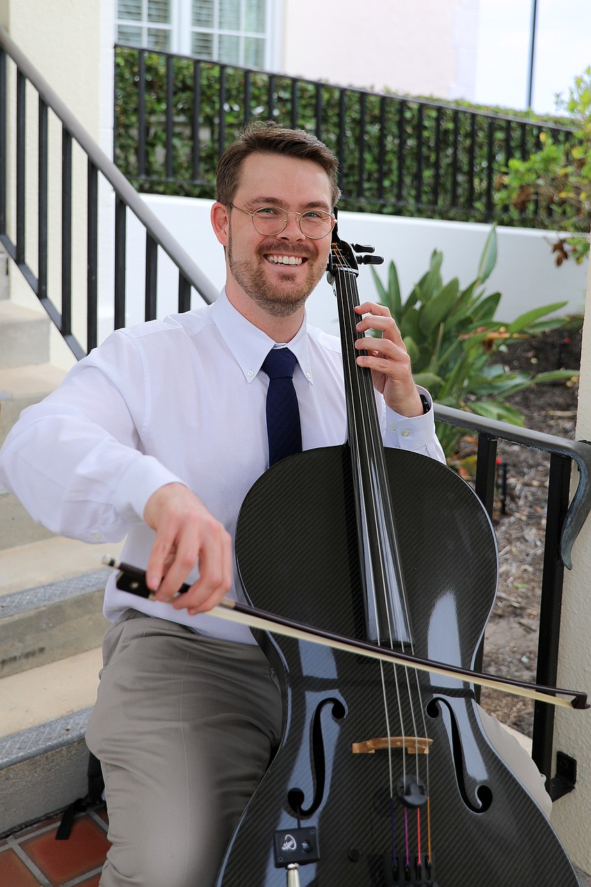 Musician Isaac Mingus welcomes guests with sweet music.