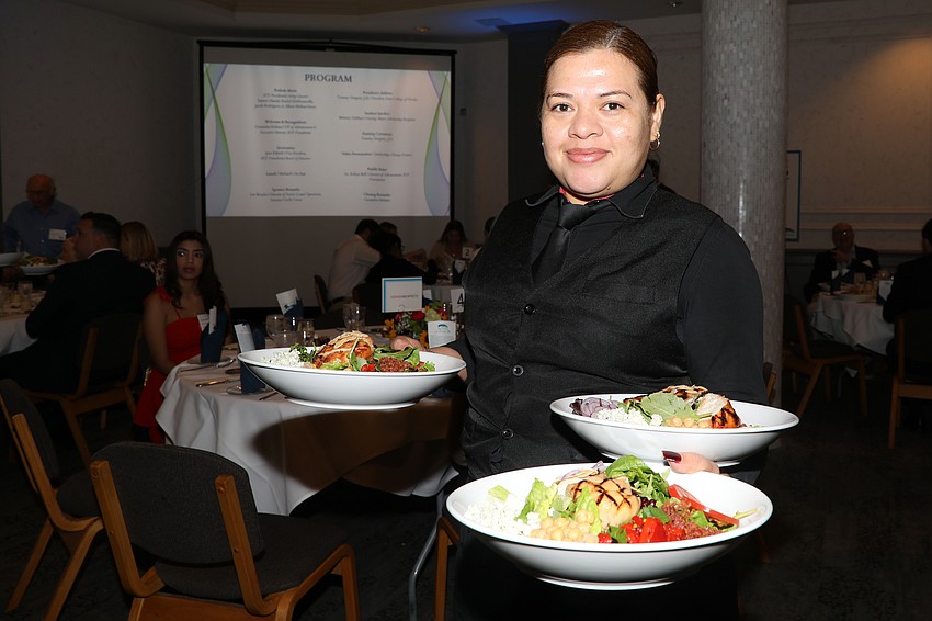 Wendy Cortez serves salad at Michael's On East.