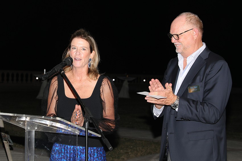 Co-chairs Elizabeth Moore and Don Robertson give a warm welcome to the clambake guests.