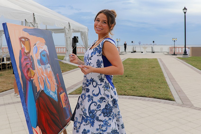 New College junior Lucy Duke paints a work titled 