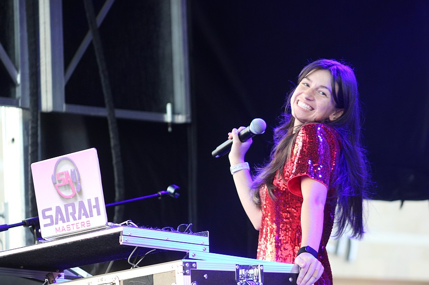 DJ Sarah Masters kept the holiday music flowing at the Santa's Grand Arrival Parade.