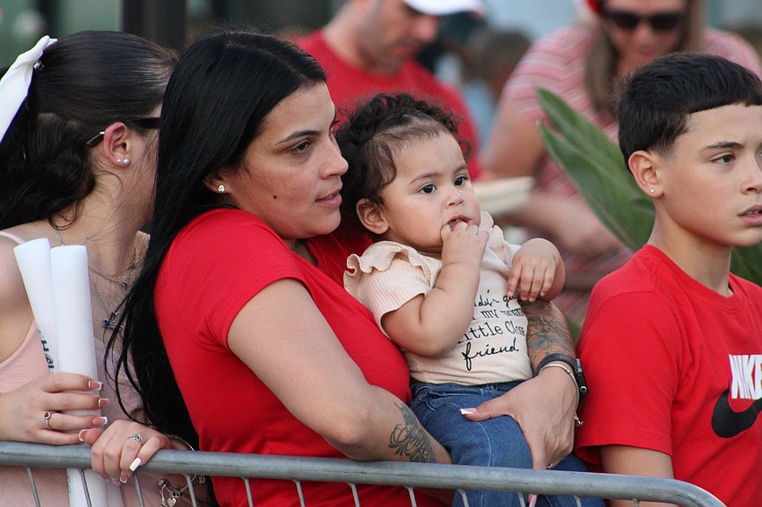 Bradenton's Sheila Correa brings 1-year-old Roxana Correa to her first Santa's Grand Arrival Parade.