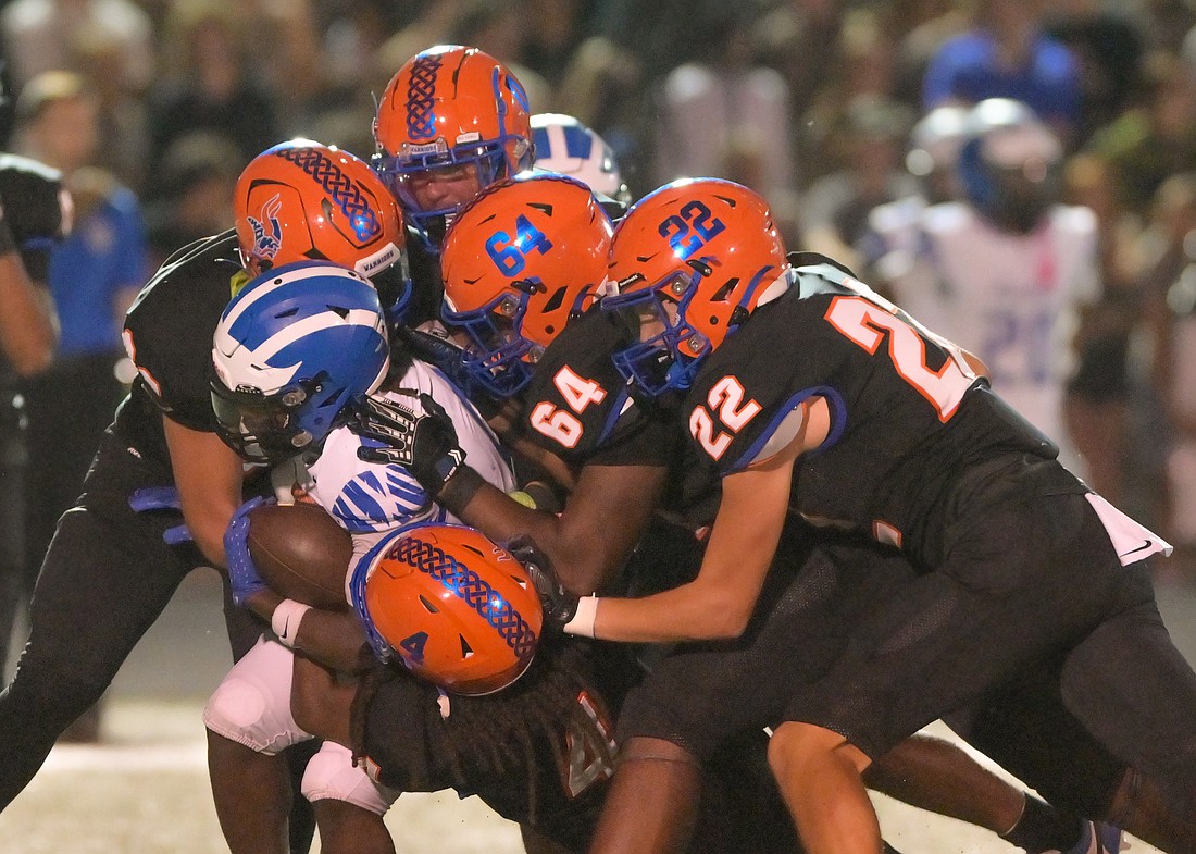 A host of West Orange players brought down the Apopka ball carrier in the Warriors Week 6 win.