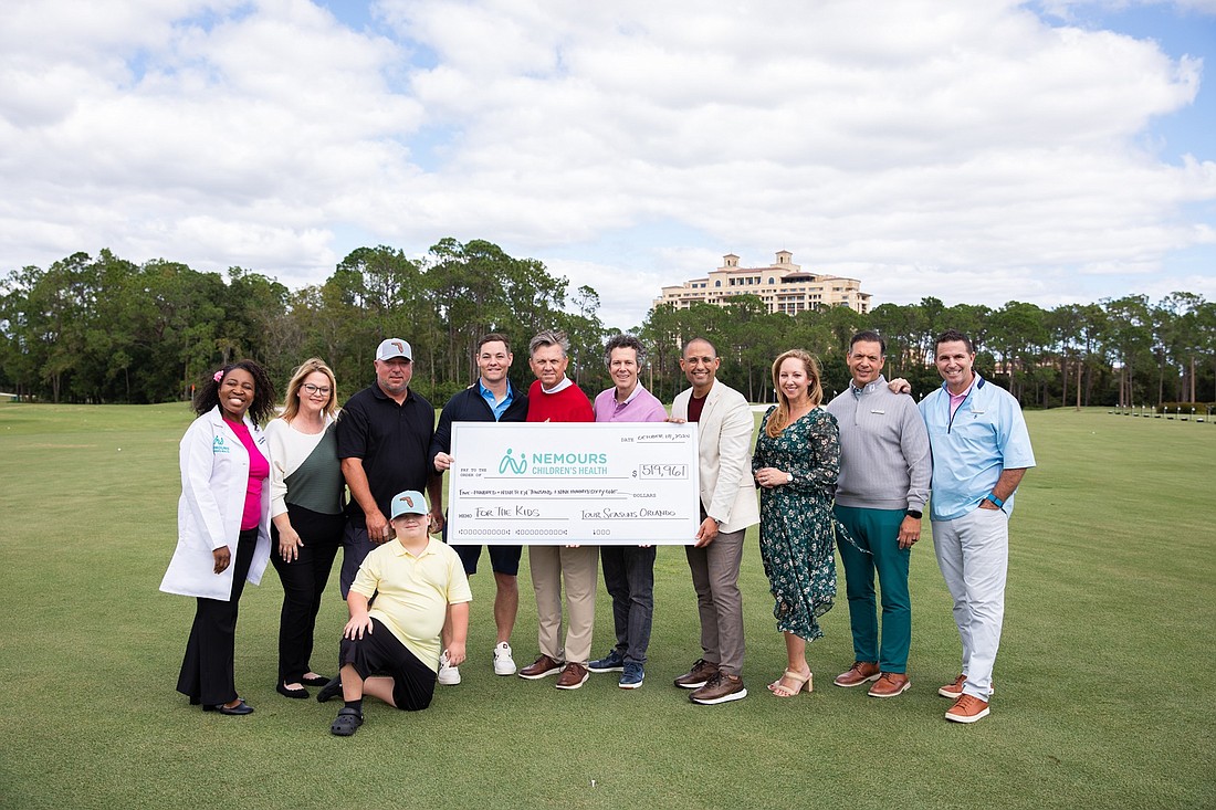 From left: Dr. Dorothea Douglas Lindsay, ediatric hematologist/oncologist at Nemours Children’s Hospital, Florida; Judith and Jeremy Shaver and son Luke; James Henley, associate vice president of philanthropy at Nemours Children’s Health; and Four Seasons team members Rodney Cook, director of golf instruction; Alan Reichbart, regional director of marketing; Ali Mohammed, regional vice president and general manager; Dana Berry, senior director of public relations and communications; Robert Scott, head golf professional; and Joe Angelino, club general manager.
