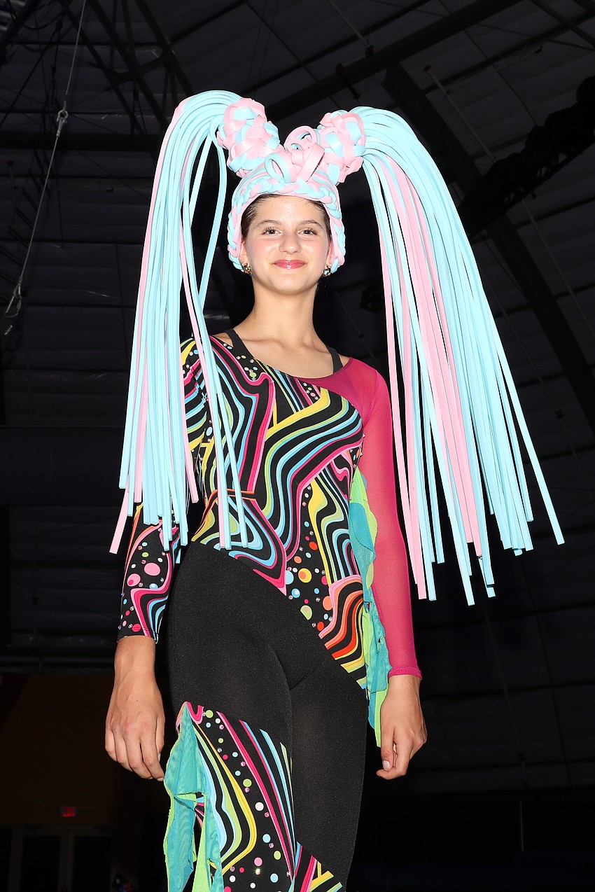 Mia Spiro, 11, walks on stilts.
