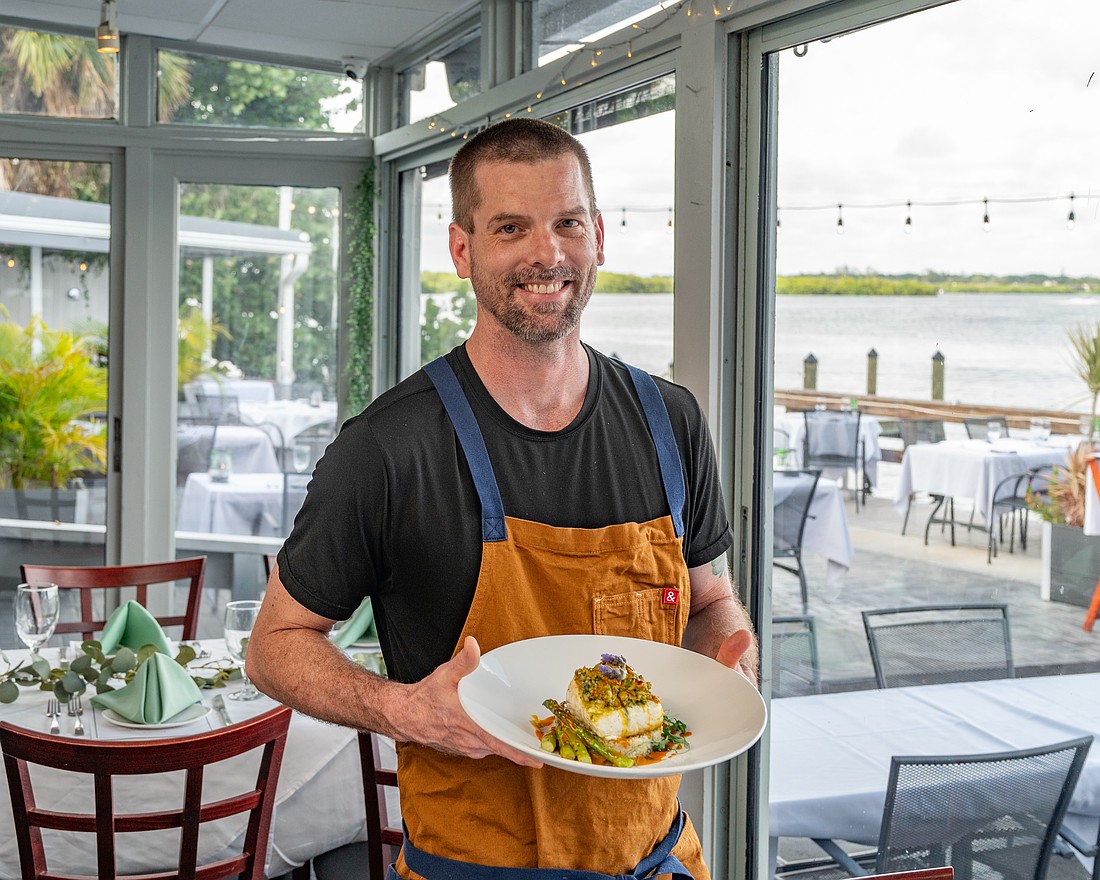 Ophelia’s executive chef Nick Reddel is constantly reinventing the menu to offer guests new taste experiences. Here he shows off one of his signature dishes — Alaskan halibut.