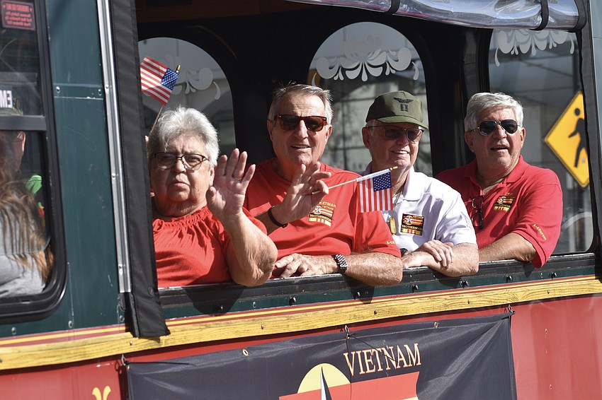 A buss with members of the Vietnam Brotherhood approaches.