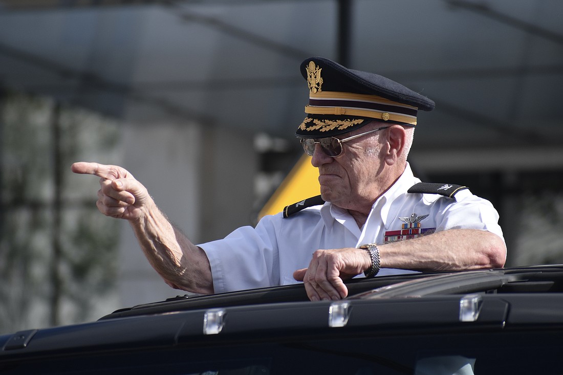 Col. Ben Knisely, who served 28 years in the U.S. Army and was honored as Veteran of the Year, interacts with the public during the 2024 Veterans Day parade.