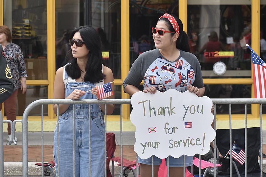 Danae and Krits Tran celebrated veterans with a sign.