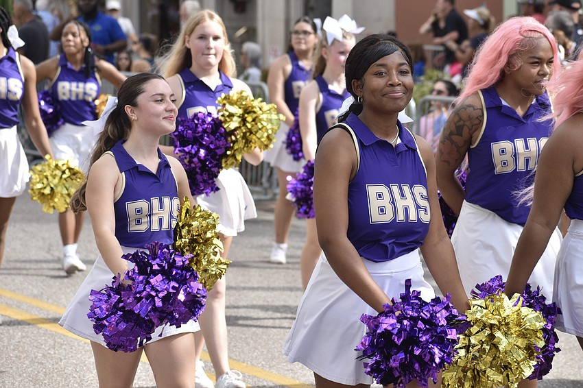 Cheerleaders from Booker High School march in the parade.