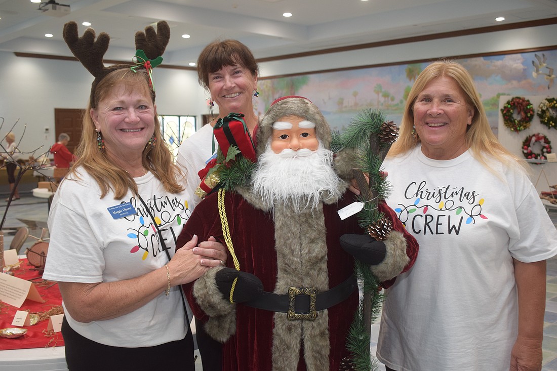 Maggie Oberst, Catherine Costello and Bonnie Schneider at the St. Mary Christmas Bazaar.